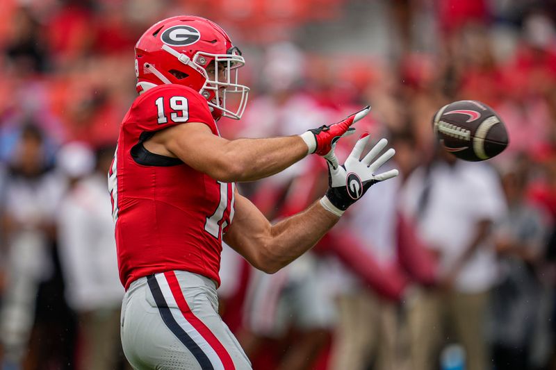 Sep 16, 2023; Athens, Georgia, USA; Georgia Bulldogs tight end Brock Bowers (19) catches a pass while warming up before the game against the South Carolina Gamecocks at Sanford Stadium. Mandatory Credit: Dale Zanine-USA TODAY Sports