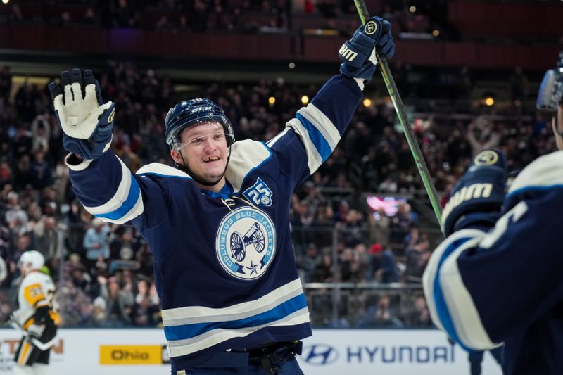 Jan 4, 2026; Columbus, Ohio, USA;  Columbus Blue Jackets left wing Dmitri Voronkov (10) celebrates with teammates after scoring a goal against the Pittsburgh Penguins in the first period at Nationwide Arena. Mandatory Credit: Aaron Doster-Imagn Images