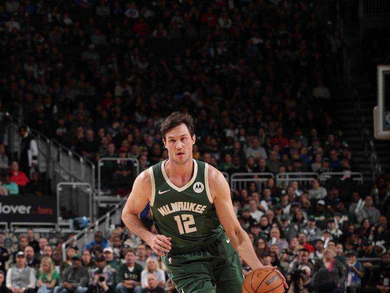 MILWAUKEE, WI - APRIL 3:  Danilo Gallinari #12 of the Milwaukee Bucks dribbles the ball during the game against the Memphis Grizzlies on April 3, 2024 at the Fiserv Forum Center in Milwaukee, Wisconsin. NOTE TO USER: User expressly acknowledges and agrees that, by downloading and or using this Photograph, user is consenting to the terms and conditions of the Getty Images License Agreement. Mandatory Copyright Notice: Copyright 2024 NBAE (Photo by Gary Dineen/NBAE via Getty Images).