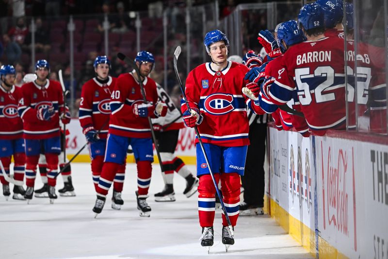 Oct 1, 2024; Montreal, Quebec, CAN; Montreal Canadiens center Oliver Kapanen (91) celebrates his goal against the Ottawa Senators with his teammates at the bench during the third period at Bell Centre. Mandatory Credit: David Kirouac-Imagn Images