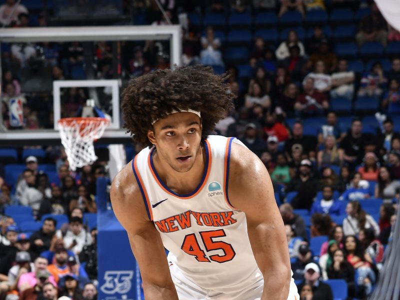 ORLANDO, FL - FEBRUARY 14: Jericho Sims #45 of the New York Knicks looks to pass the ball during the game against the Orlando Magic on February 14, 2024 at the Kia Center in Orlando, Florida. NOTE TO USER: User expressly acknowledges and agrees that, by downloading and or using this photograph, User is consenting to the terms and conditions of the Getty Images License Agreement. Mandatory Copyright Notice: Copyright 2024 NBAE (Photo by Fernando Medina/NBAE via Getty Images)