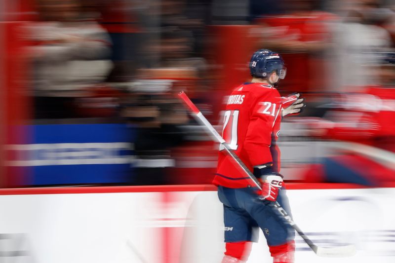 Feb 26, 2024; Washington, District of Columbia, USA; Washington Capitals center Aliaksei Protas (21) celebrates with teammates after scoring a goal against the Ottawa Senators in the first period at Capital One Arena. Mandatory Credit: Geoff Burke-USA TODAY Sports