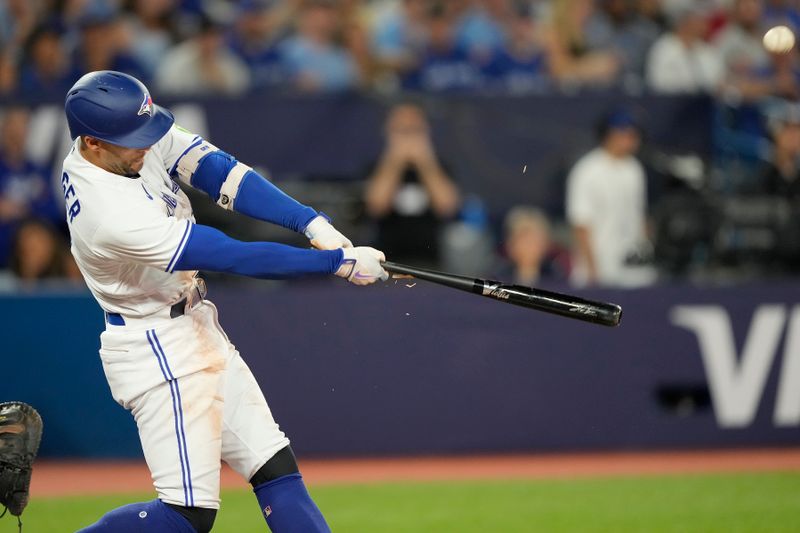 Jul 19, 2023; Toronto, Ontario, CAN; Toronto Blue Jays right fielder George Springer (4) breaks his bat on a fly ball to the San Diego Padres during the second inning at Rogers Centre. Mandatory Credit: John E. Sokolowski-USA TODAY Sports