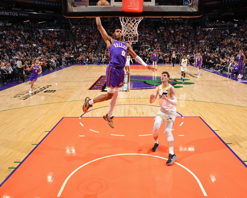 PHOENIX, AZ - JANUARY 11: Ryan Dunn #0 of the Phoenix Suns dunks the ball during the game against the Utah Jazz on January 11, 2025 at Footprint Center in Phoenix, Arizona. NOTE TO USER: User expressly acknowledges and agrees that, by downloading and or using this photograph, user is consenting to the terms and conditions of the Getty Images License Agreement. Mandatory Copyright Notice: Copyright 2025 NBAE (Photo by Barry Gossage/NBAE via Getty Images)