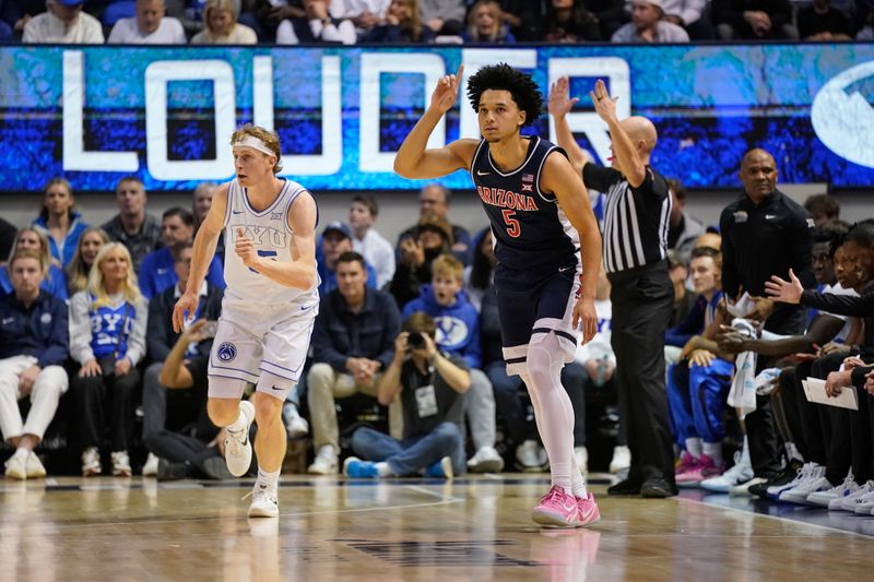 Jan 26, 2026; Provo, Utah, USA; Arizona Wildcats guard Brayden Burries (5) reacts to a three-pointer during the first half against the BYU Cougars at Marriott Center. Mandatory Credit: Aaron Baker-Imagn Images 