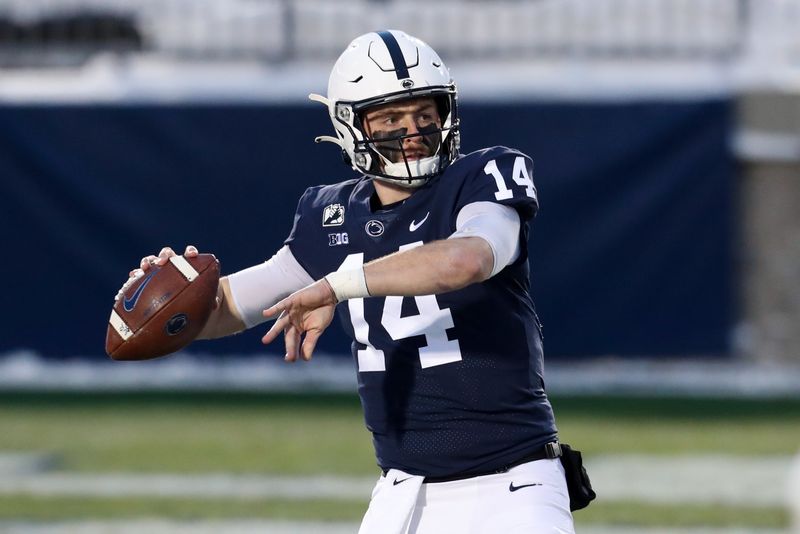 Dec 19, 2020; University Park, Pennsylvania, USA; Penn State Nittany Lions quarterback Sean Clifford (14) warms up prior to the game against the Illinois Fighting Illini at Beaver Stadium. Mandatory Credit: Matthew OHaren-USA TODAY Sports