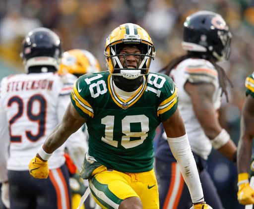 Green Bay Packers wide receiver Malik Heath (18) reacts after a catch during an NFL football game against the Chicago Bears Sunday, Jan. 5, 2025, in Green Bay, Wis. (AP Photo/Jeffrey Phelps