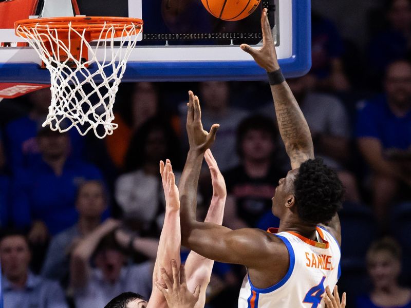 Feb 28, 2024; Gainesville, Florida, USA; Florida Gators forward Tyrese Samuel (4) shoots over Missouri Tigers forward Jesus Carralero Martin (13) and guard Nick Honor (10) during the first half at Exactech Arena at the Stephen C. O'Connell Center. Mandatory Credit: Matt Pendleton-USA TODAY Sports