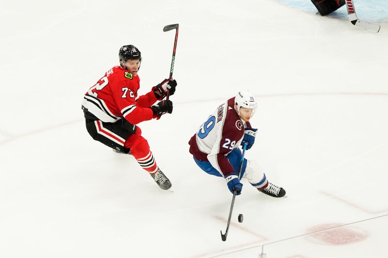 Feb 29, 2024; Chicago, Illinois, USA; Chicago Blackhawks defenseman Alex Vlasic (72) defends Colorado Avalanche center Nathan MacKinnon (29) during the third period at United Center. Mandatory Credit: David Banks-USA TODAY Sports