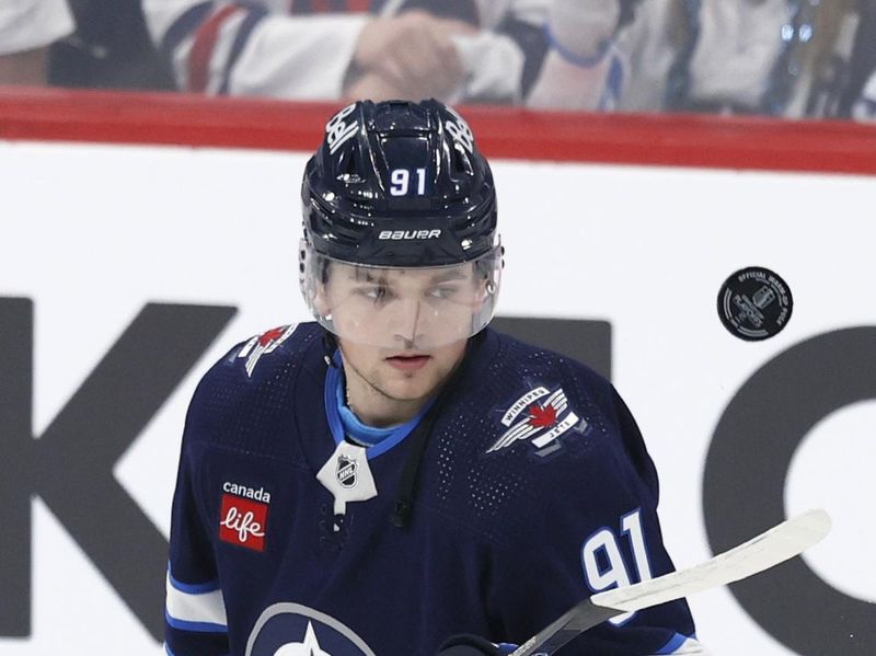 Apr 30, 2024; Winnipeg, Manitoba, CAN; Winnipeg Jets center Cole Perfetti (91) puck juggles before the game against the Colorado Avalanche in game five of the first round of the 2024 Stanley Cup Playoffs at Canada Life Centre. Mandatory Credit: James Carey Lauder-USA TODAY Sports