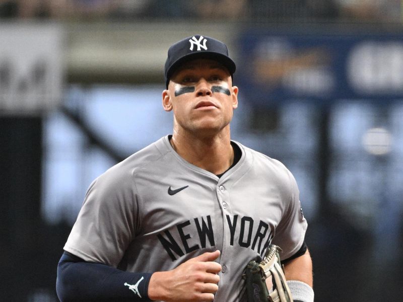 Apr 27, 2024; Milwaukee, Wisconsin, USA; New York Yankees outfielder Aaron Judge (99) runs in from the outfield against the Milwaukee Brewers in the fourth inning at American Family Field. Mandatory Credit: Michael McLoone-USA TODAY Sports