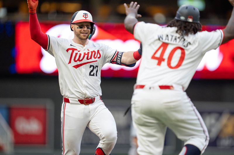 Jul 4, 2024; Minneapolis, Minnesota, USA; Minnesota Twins catcher Ryan Jeffers (27) celebrates with third base coach Tommy Watkins (40) after hitting a home run against the Detroit Tigers in the fourth inning at Target Field. Mandatory Credit: Matt Blewett-USA TODAY Sports