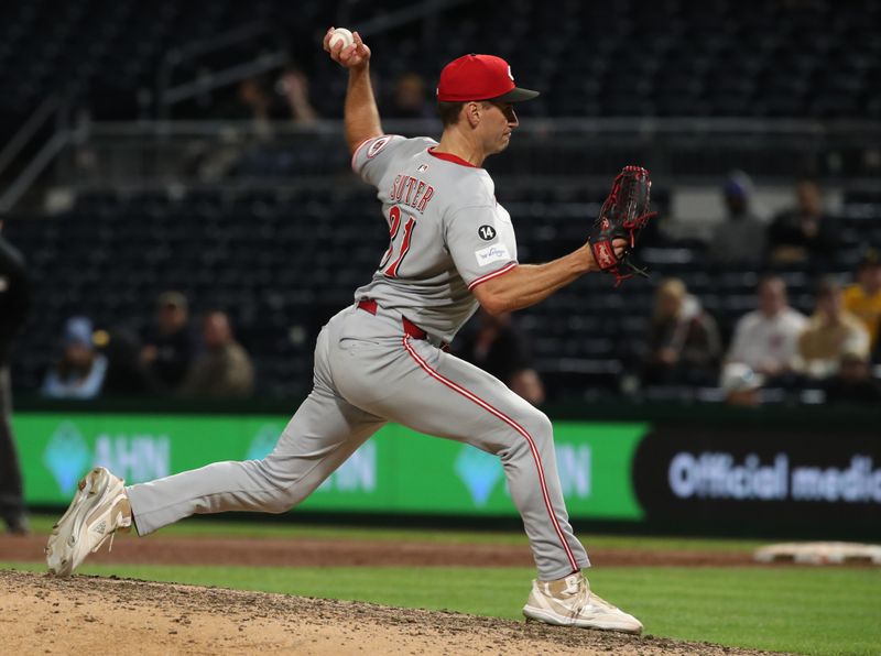 May 19, 2025; Pittsburgh, Pennsylvania, USA;  Cincinnati Reds relief pitcher Brent Suter (31) pitches against the Pittsburgh Pirates during the ninth inning at PNC Park. Mandatory Credit: Charles LeClaire-Imagn Images