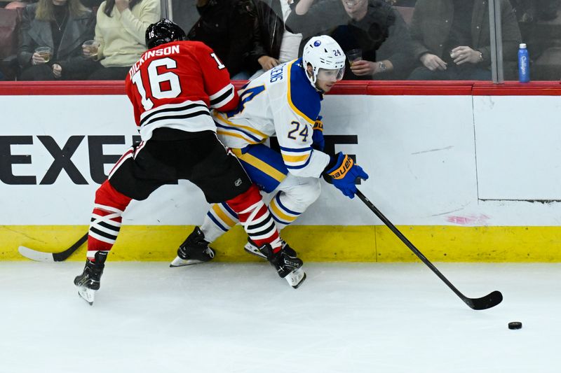 Oct 19, 2024; Chicago, Illinois, USA;  Buffalo Sabres center Dylan Cozens (24) moves the puck against Chicago Blackhawks center Jason Dickinson (16) during the second period at the United Center. Mandatory Credit: Matt Marton-Imagn Images