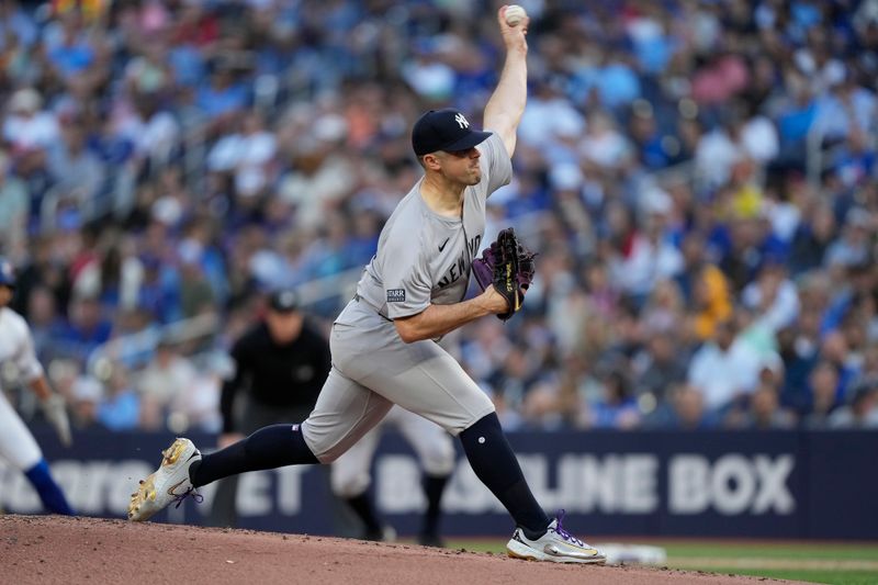 Jun 27, 2024; Toronto, Ontario, CAN; New York Yankees starting pitcher Carlos Rodon (55) pitches to the Toronto Blue Jays during the first inning at Rogers Centre. Mandatory Credit: John E. Sokolowski-USA TODAY Sports