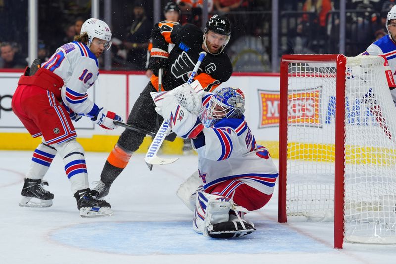 Nov 29, 2024; Philadelphia, Pennsylvania, USA; New York Rangers goalie Igor Shesterkin (31) makes a save against Philadelphia Flyers center Sean Couturier (14) in the first period at Wells Fargo Center. Mandatory Credit: Kyle Ross-Imagn Images