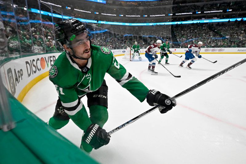 May 15, 2024; Dallas, Texas, USA; Dallas Stars left wing Mason Marchment (27) clears the puck against the Colorado Avalanche during the first period in game five of the second round of the 2024 Stanley Cup Playoffs at American Airlines Center. Mandatory Credit: Jerome Miron-USA TODAY Sports