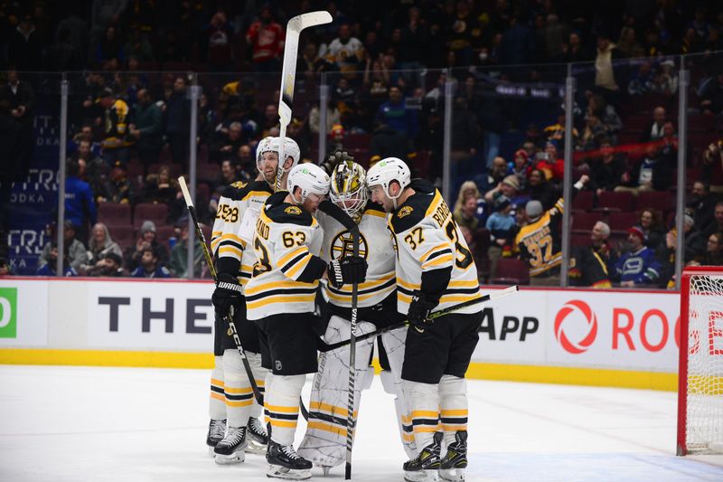 Feb 25, 2023; Vancouver, British Columbia, CAN; Boston Bruins goaltender Linus Ullmark (35) celebrates his empty net goal during the third period at Rogers Arena. Mandatory Credit: Anne-Marie Sorvin-USA TODAY Sports