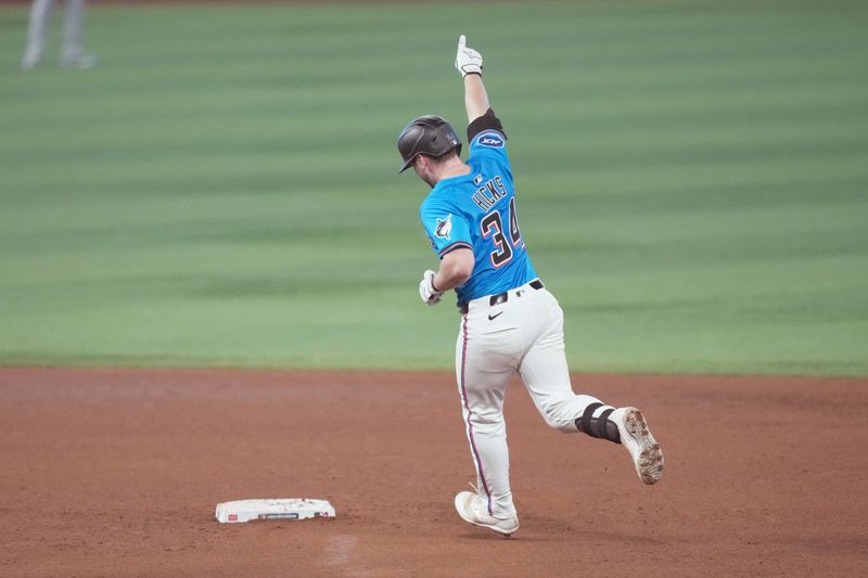 May 18, 2025; Miami, Florida, USA;  Miami Marlins catcher Liam Hicks (34) rounds the bases after hitting a two-run home run in the sixth inning against the Tampa Bay Rays at loanDepot Park. Mandatory Credit: Jim Rassol-Imagn Images