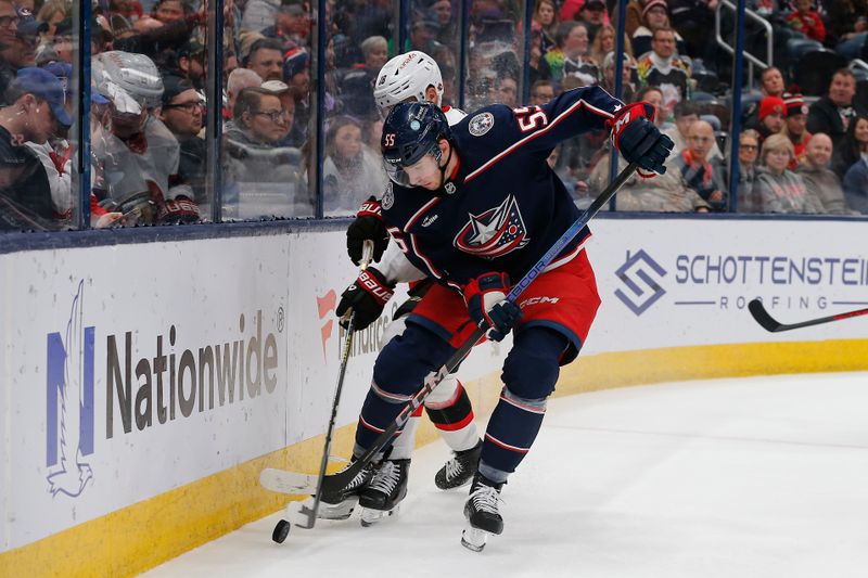 Dec 1, 2023; Columbus, Ohio, USA; Columbus Blue Jackets defenseman David Jiricek (55) battles for the puck with Ottawa Senators left wing Tim Stutzle (18) during the first period at Nationwide Arena. Mandatory Credit: Russell LaBounty-USA TODAY Sports