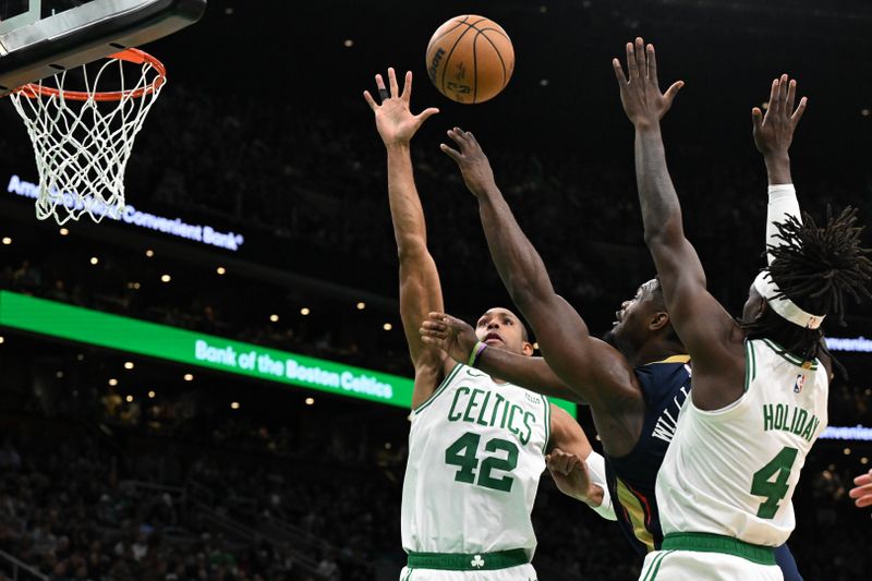 BOSTON, MASSACHUSETTS - JANUARY 29: Zion Williamson #1 of the New Orleans Pelicans attempts a basket in between Al Horford #42 of the Boston Celtics and Jrue Holiday #4 during the third quarter at the TD Garden on January 29, 2024 in Boston, Massachusetts. NOTE TO USER: User expressly acknowledges and agrees that, by downloading and or using this photograph, User is consenting to the terms and conditions of the Getty Images License Agreement. (Photo by Brian Fluharty/Getty Images)