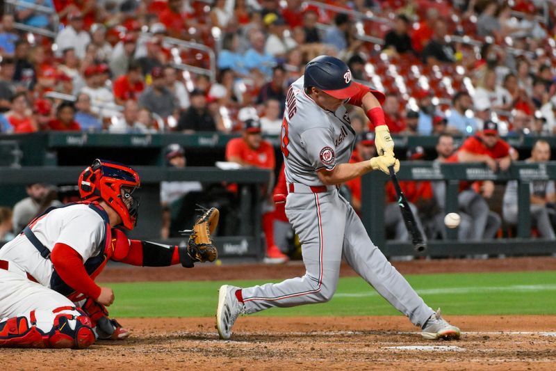 Jul 10, 2025; St. Louis, Missouri, USA;  Washington Nationals center fielder Jacob Young (30) drives in a run as he hits in to a fielders choice against the St. Louis Cardinals during the eighth inning at Busch Stadium. Mandatory Credit: Jeff Curry-Imagn Images