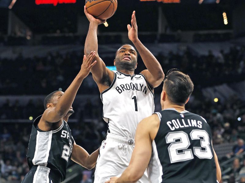 SAN ANTONIO, TX - JANUARY 17:  T.J. Warren #1 of the Brooklyn Nets shots over Zach Collins #23 of the San Antonio Spurs in the first half at AT&T Center on January 17, 2023 in San Antonio, Texas. NOTE TO USER: User expressly acknowledges and agrees that, by downloading and or using this photograph, User is consenting to terms and conditions of the Getty Images License Agreement. (Photo by Ronald Cortes/Getty Images)