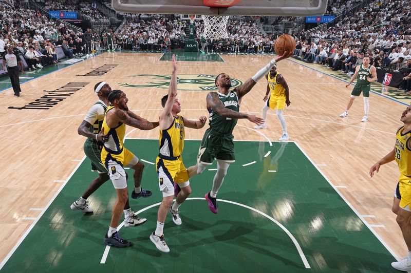 MILWAUKEE, WI - APRIL 23: Damian Lillard #0 of the Milwaukee Bucks drives to the basket during Round 1 Game 2 of the 2024 NBA Playoffs against the Indiana Pacers on April 23, 2024 at the Fiserv Forum Center in Milwaukee, Wisconsin. NOTE TO USER: User expressly acknowledges and agrees that, by downloading and or using this Photograph, user is consenting to the terms and conditions of the Getty Images License Agreement. Mandatory Copyright Notice: Copyright 2024 NBAE (Photo by Jeff Haynes/NBAE via Getty Images).