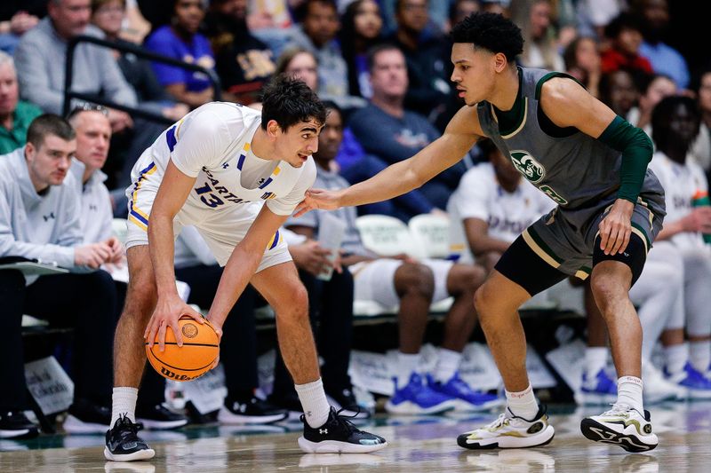 Feb 9, 2024; Fort Collins, Colorado, USA; San Jose State Spartans guard Alvaro Cardenas (13) controls the ball against Colorado State Rams guard Josiah Strong (3) in the second half at Moby Arena. Mandatory Credit: Isaiah J. Downing-USA TODAY Sports