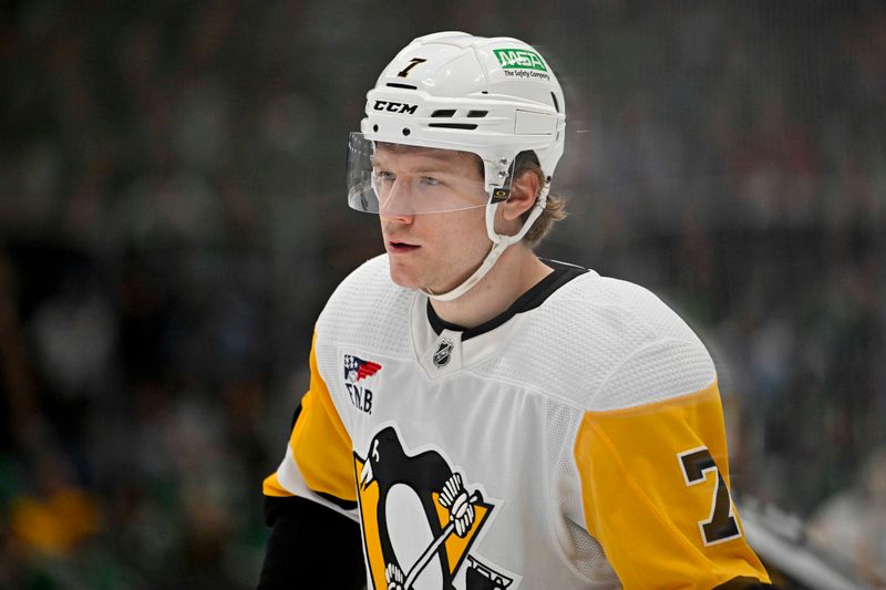 Mar 22, 2024; Dallas, Texas, USA; Pittsburgh Penguins defenseman John Ludvig (7) waits for the face-off against the Dallas Stars during the first period at the American Airlines Center. Mandatory Credit: Jerome Miron-USA TODAY Sports