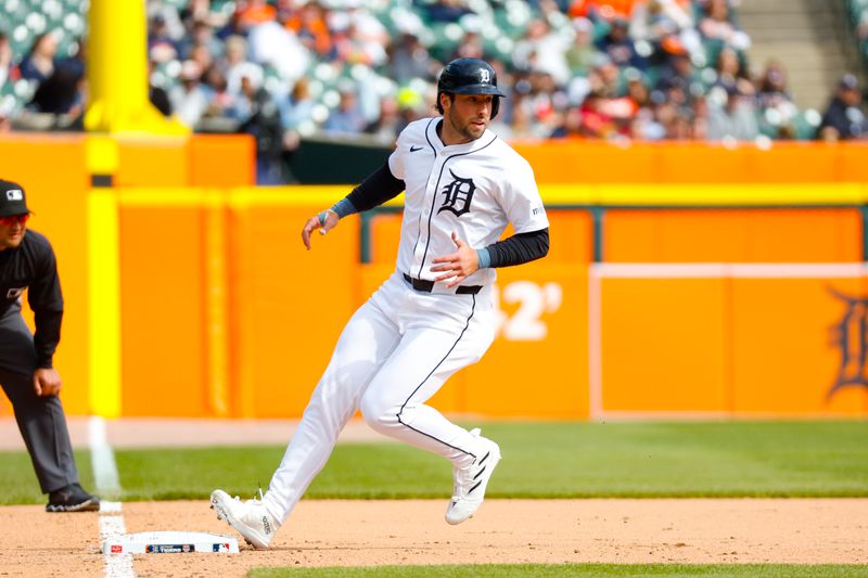 Apr 7, 2024; Detroit, Michigan, USA; Detroit Tigers outfielder Matt Vierling (8) tags third base during the game against the Oakland Athletics at Comerica Park. Mandatory Credit: Brian Bradshaw Sevald-USA TODAY Sports