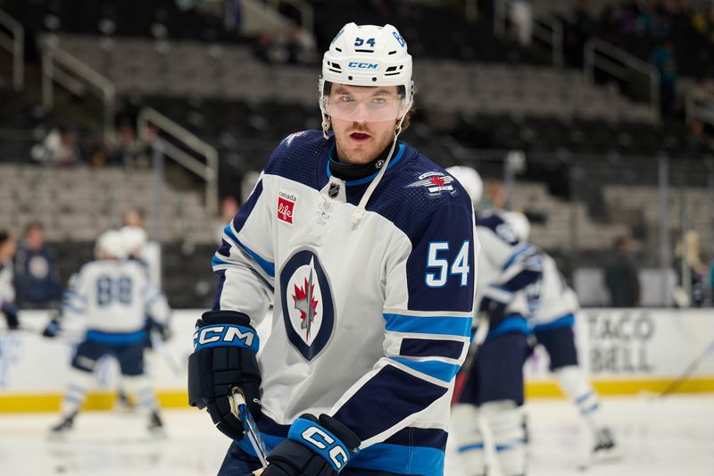 Dec 12, 2023; San Jose, California, USA; Winnipeg Jets defenseman Dylan Samberg (54) skates during warmups before the game between the San Jose Sharks and the Winnipeg Jets at SAP Center at San Jose. Mandatory Credit: Robert Edwards-USA TODAY Sports