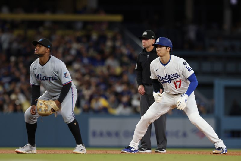 Apr 28, 2025; Los Angeles, California, USA;  Los Angeles Dodgers two-way player Shohei Ohtani (17) looks on against Miami Marlins shortstop Xavier Edwards (9) in the third inning at Dodger Stadium. Mandatory Credit: Jason Parkhurst-Imagn Images