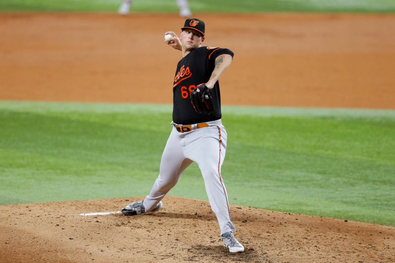 Oct 10, 2023; Arlington, Texas, USA; Baltimore Orioles relief pitcher Tyler Wells (68) pitches against the Texas Rangers in the third inning during game three of the ALDS for the 2023 MLB playoffs at Globe Life Field. Mandatory Credit: Andrew Dieb-USA TODAY Sports