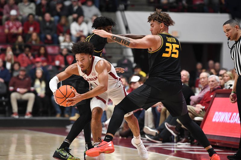 Jan 16, 2024; Tuscaloosa, Alabama, USA; Alabama guard Mark Sears (1) escapes a double team by Missouri guard Anthony Robinson II (14) and Missouri forward Noah Carter (35) at Coleman Coliseum. Mandatory Credit: Gary Cosby Jr.-USA TODAY Sports