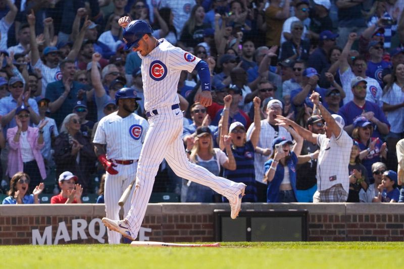 May 7, 2023; Chicago, Illinois, USA; Chicago Cubs center fielder Cody Bellinger (24) scores against the Miami Marlins during the ninth inning at Wrigley Field. Mandatory Credit: David Banks-USA TODAY Sports