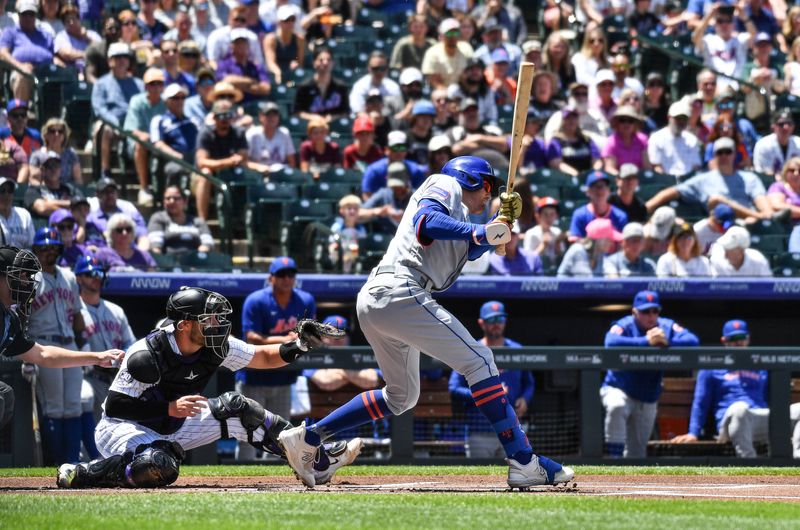 May 28, 2023; Denver, Colorado, USA; New York Mets designated hitter Brandon Nimmo (9) hits a single in the first inning against the Colorado Rockies at Coors Field. Mandatory Credit: John Leyba-USA TODAY Sports