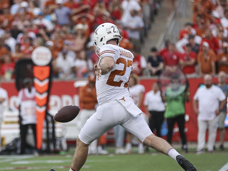 Oct 21, 2023; Houston, Texas, USA; Texas Longhorns punter Ryan Sanborn (27) punts the ball during the game against the Houston Cougars at TDECU Stadium. Mandatory Credit: Troy Taormina-USA TODAY Sports