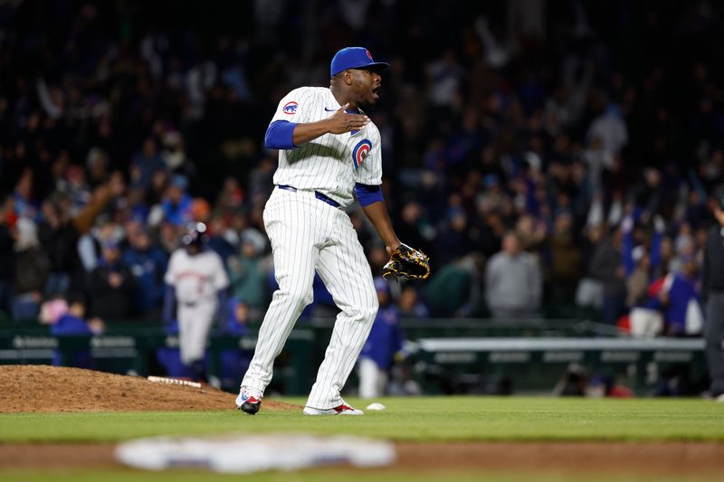 Apr 24, 2024; Chicago, Illinois, USA; Chicago Cubs relief pitcher Héctor Neris (51) celebrates the win against the Houston Astros at Wrigley Field. Mandatory Credit: Kamil Krzaczynski-USA TODAY Sports