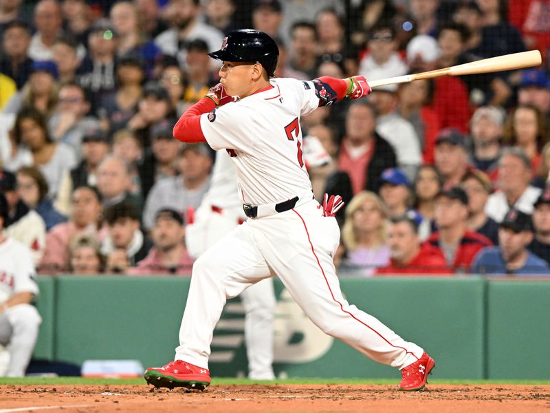 Apr 28, 2024; Boston, Massachusetts, USA;  Boston Red Sox left fielder Masataka Yoshida (7) hits a RBI single against the Chicago Cubs during the third inning at Fenway Park. Mandatory Credit: Brian Fluharty-USA TODAY Sports