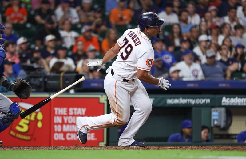 May 17, 2023; Houston, Texas, USA; Houston Astros first baseman Jose Abreu (79) hits an RBI single during the eighth inning against the Chicago Cubs at Minute Maid Park. Mandatory Credit: Troy Taormina-USA TODAY Sports