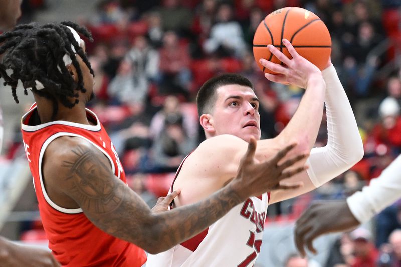 Jan 13, 2024; Pullman, Washington, USA; Washington State Cougars forward Andrej Jakimovski (23) shoots the ball against Arizona Wildcats guard Caleb Love (2) in the first half at Friel Court at Beasley Coliseum. Mandatory Credit: James Snook-USA TODAY Sports