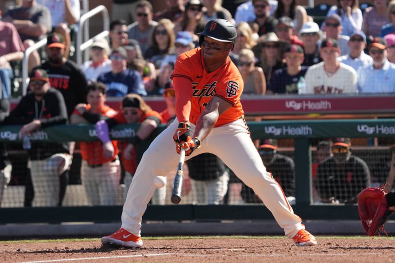 Feb 22, 2026; Scottsdale, Arizona, USA; San Francisco Giants designated hitter Rafael Devers (16) hits against the Chicago Cubs in the third inning at Scottsdale Stadium. Mandatory Credit: Rick Scuteri-Imagn Images