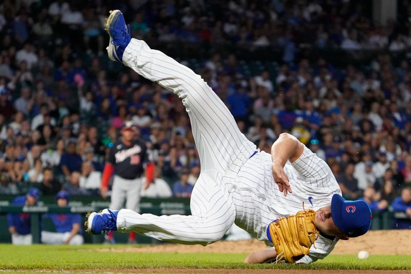 Jul 18, 2023; Chicago, Illinois, USA; Chicago Cubs starting pitcher Jameson Taillon (50) can t make a play on an infield single hit by Washington Nationals first baseman Dominic Smith (not pictured) during the sixth inning at Wrigley Field. Mandatory Credit: David Banks-USA TODAY Sports