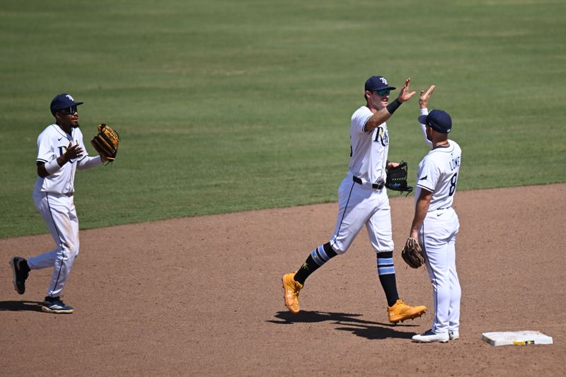 May 21, 2025; St. Petersburg, Florida, USA; Members of the  Tampa Bay Rays  celebrate after defeating the Houston Astros at George M. Steinbrenner Field. Mandatory Credit: Jonathan Dyer-Imagn Images
