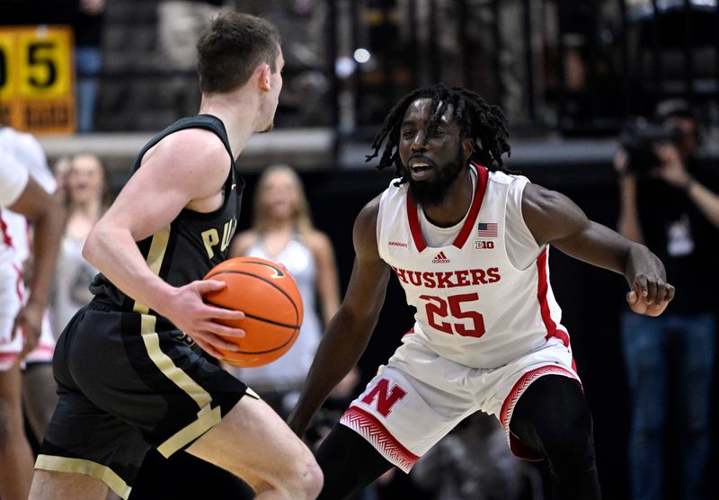 Jan 13, 2023; West Lafayette, Indiana, USA;  Nebraska Cornhuskers guard Emmanuel Bandoumel (25) defends against Purdue Boilermakers guard Braden Smith (3) during the first half at Mackey Arena. Mandatory Credit: Marc Lebryk-USA TODAY Sports