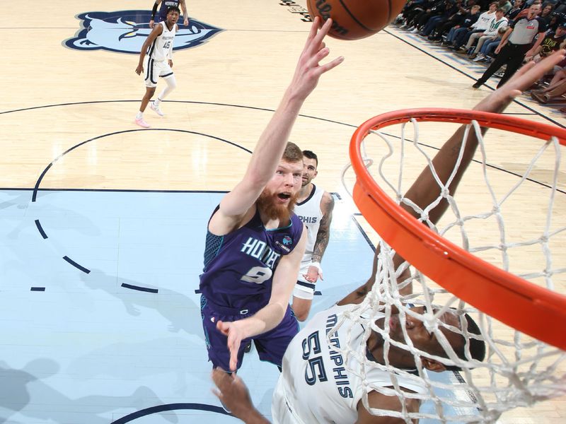 MEMPHIS, TN - MARCH 13: Davis Bertans #9 of the Charlotte Hornets drives to the basket during the game against the Memphis Grizzlies on March 13, 2024 at FedExForum in Memphis, Tennessee. NOTE TO USER: User expressly acknowledges and agrees that, by downloading and or using this photograph, User is consenting to the terms and conditions of the Getty Images License Agreement. Mandatory Copyright Notice: Copyright 2024 NBAE (Photo by Joe Murphy/NBAE via Getty Images)