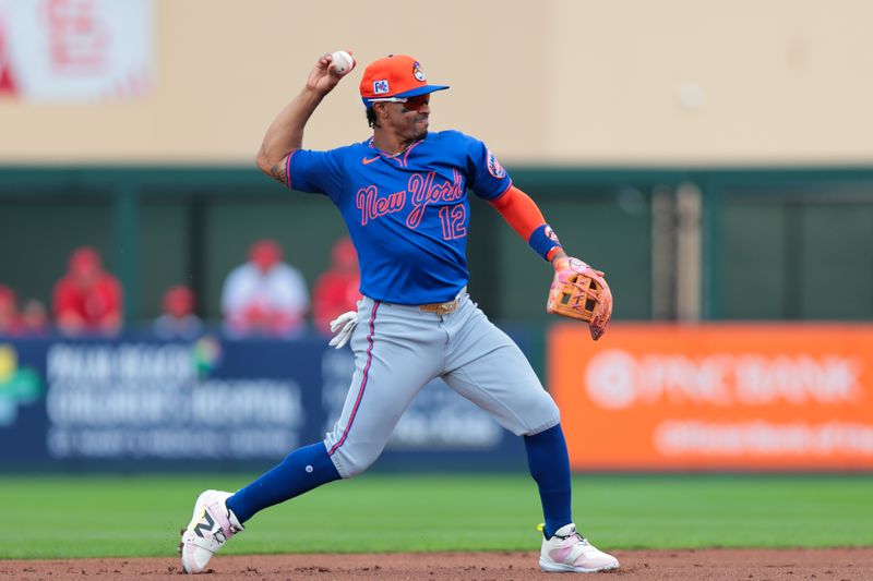 Feb 24, 2025; Jupiter, Florida, USA; New York Mets shortstop Francisco Lindor (12) throws to first base and retires St. Louis Cardinals second baseman Brendan Donovan (not pictured) during the first inning at Roger Dean Chevrolet Stadium. Mandatory Credit: Sam Navarro-Imagn Images