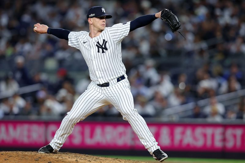 Oct 7, 2024; Bronx, New York, USA;  New York Yankees pitcher Ian Hamilton (71) throws a pitch against the Kansas City Royals in the fourth inning during game two of the ALDS for the 2024 MLB Playoffs at Yankee Stadium. Mandatory Credit: Brad Penner-Imagn Images