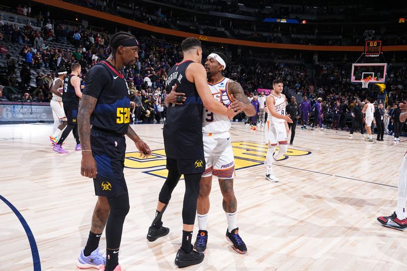 DENVER, CO - MARCH 27: Michael Porter Jr. #1 of the Denver Nuggets and Bradley Beal #3 of the Phoenix Suns embrace after the game on March 27, 2023 at the Ball Arena in Denver, Colorado. NOTE TO USER: User expressly acknowledges and agrees that, by downloading and/or using this Photograph, user is consenting to the terms and conditions of the Getty Images License Agreement. Mandatory Copyright Notice: Copyright 2024 NBAE (Photo by Garrett Ellwood/NBAE via Getty Images)